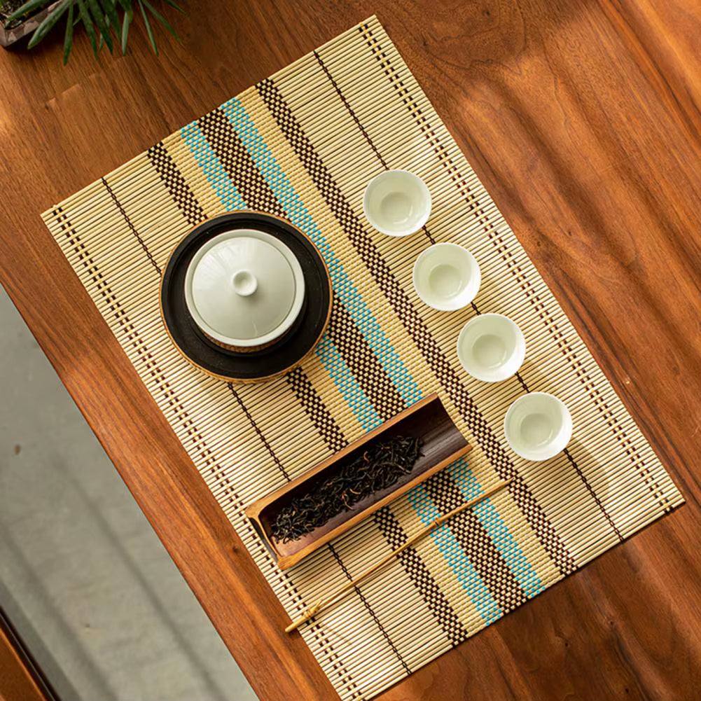 Decorative waterproof lightweight bamboo table mat with tea set on wooden table