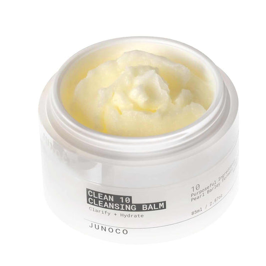 Makeup remover balm in a white jar with creamy texture for deep cleansing and hydration