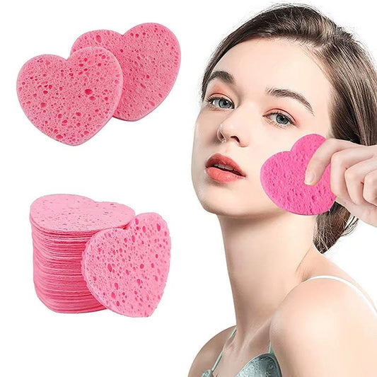 Heart-shaped pink makeup remover sponges for gentle cleansing and exfoliation.
