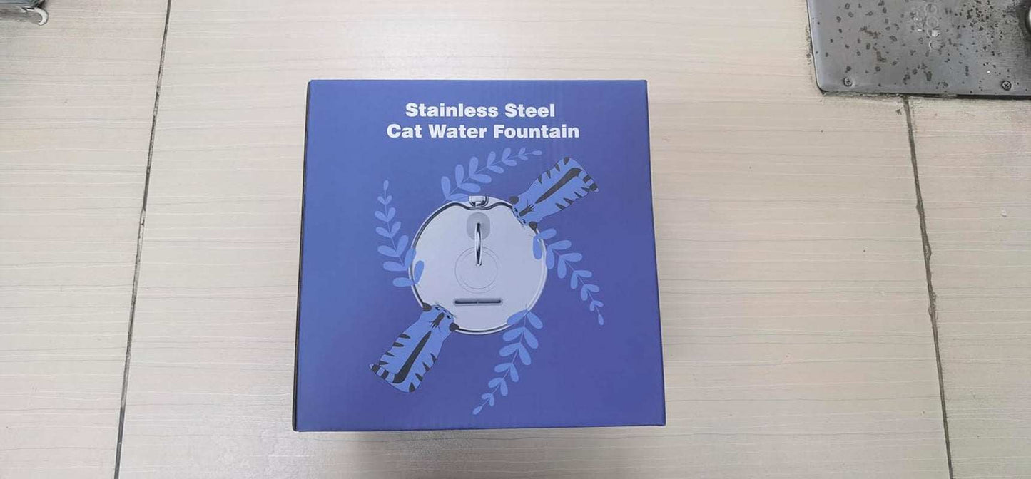 Blue box packaging of a stainless steel cat water fountain with flow design and leaf accents.