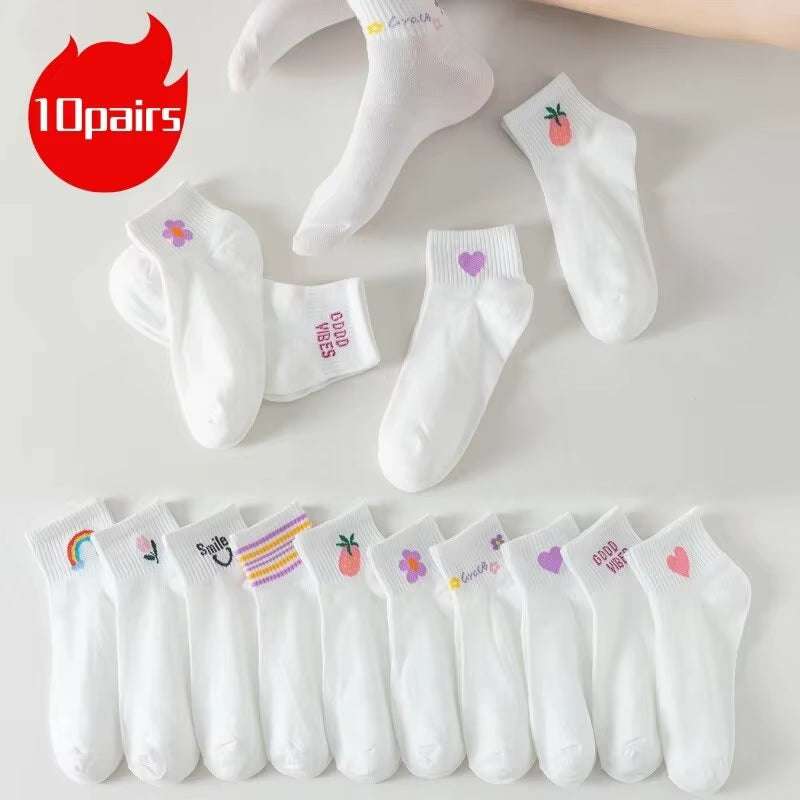 Women white socks with fun smiling face, rainbow, strawberry, and stripe patterns; pack of 10 pairs, soft cotton blend, breathable and ankle-length.