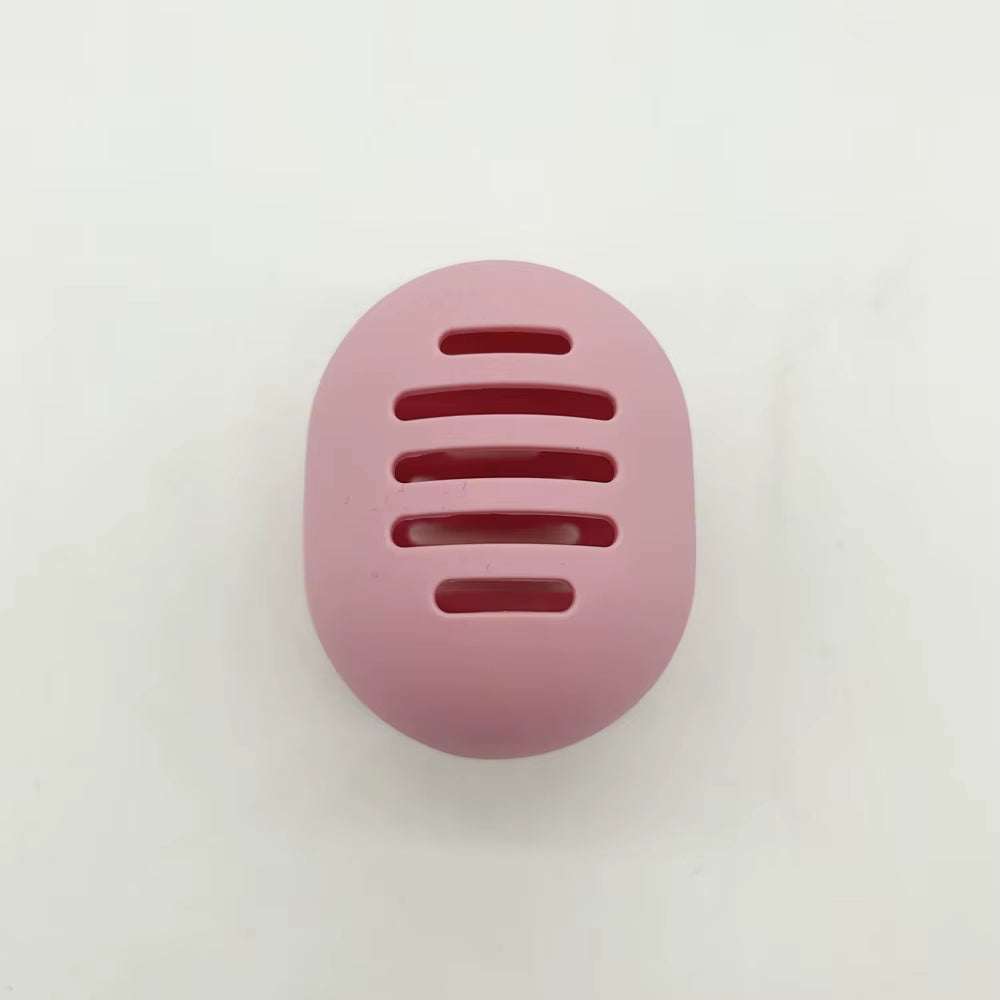 Eco-friendly silicone makeup sponge holder with ventilated pink design for hygiene and portability.