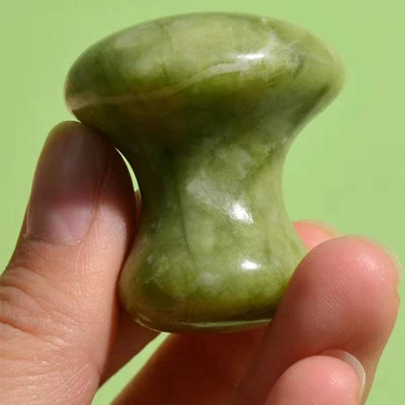 Natural green quartz mushroom-shaped Green Massager for skin care and relaxation.