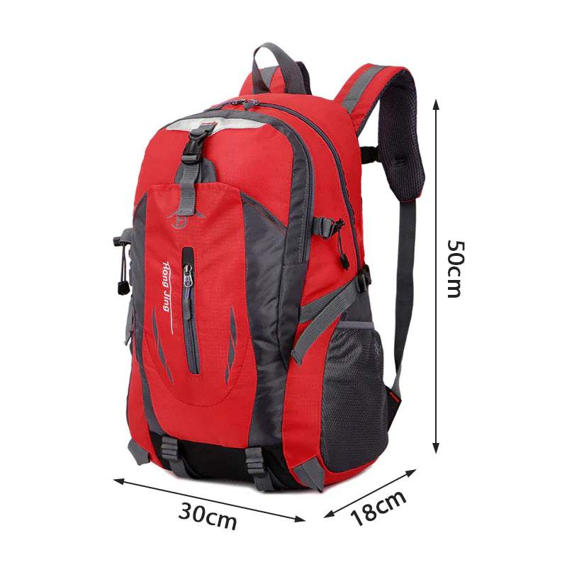 Red rucksack laptop travel backpack with multiple compartments and adjustable straps, ideal for outdoor adventures.