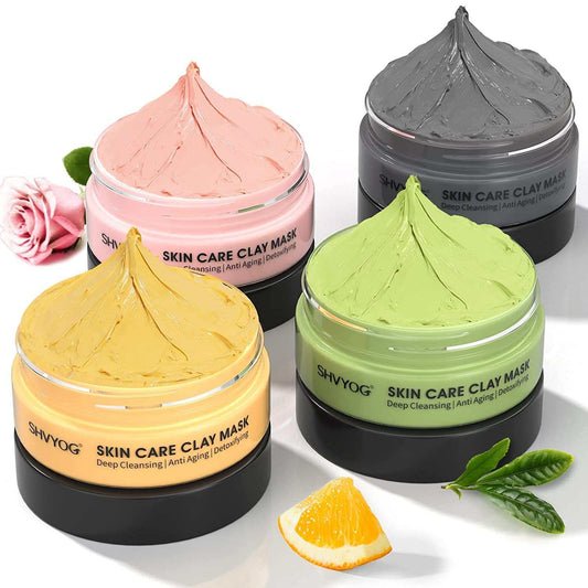 Four piece clay facial mask set with Turmeric, Vitamin C, Green Tea, and Dead Sea Mud & Rose masks in colorful jars for deep cleansing and skin care.