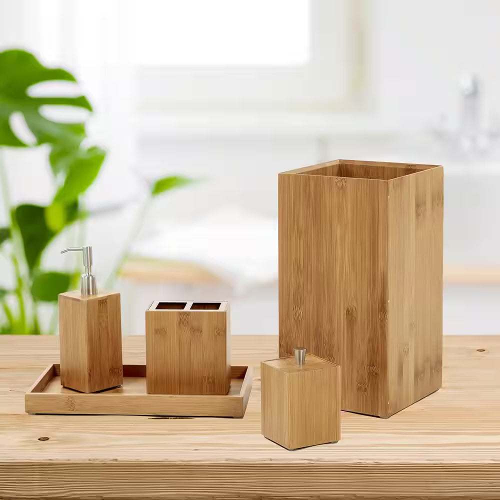 Bamboo Waste Basket 5-piece set including wastebasket, pump dispenser, toothbrush holder, cotton swab container, and towel holder on a wooden surface.
