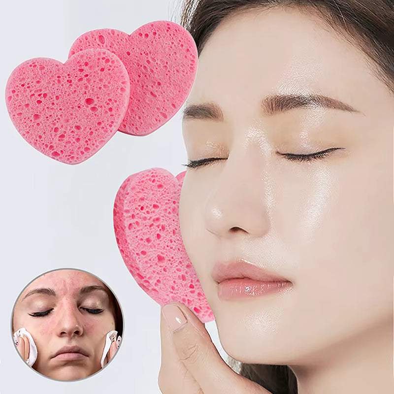 Heart-shaped pink makeup remover sponges for gentle facial cleansing and exfoliation.