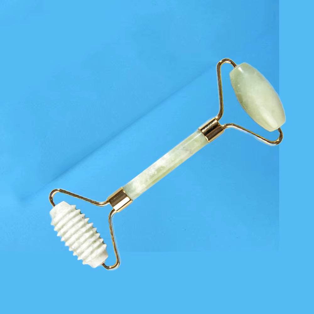 Natural jade roller and gua sha set for face massage and skincare.