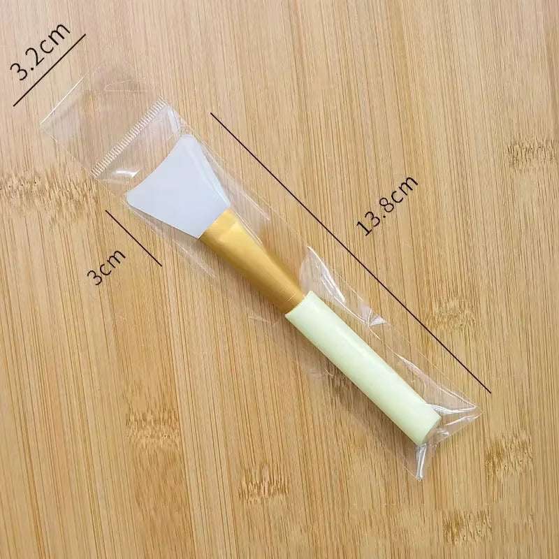 Silicone facial mask brush with soft silicone applicator and durable handle, ideal for applying skincare products.