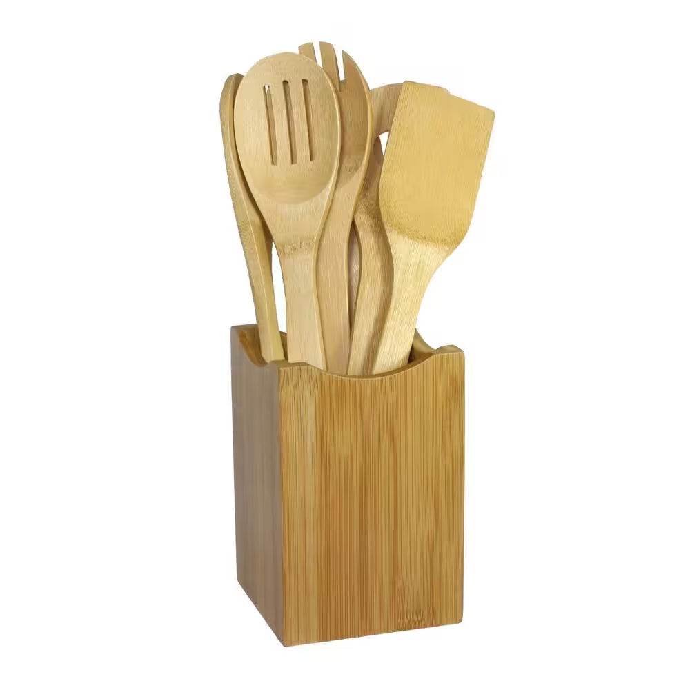 Natural bamboo spoon kitchen tool set in holder, eco-friendly utensils for cooking.