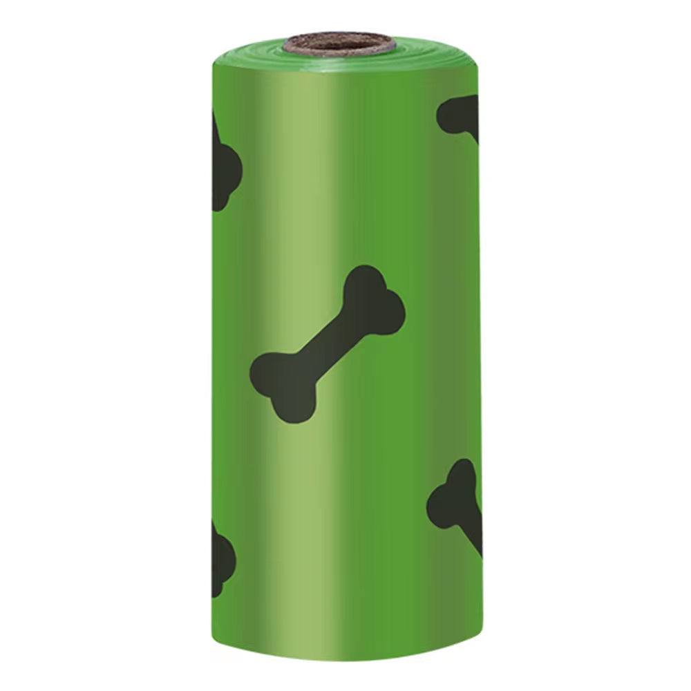 Green roll of dog waste bags with black bone prints for outdoor use