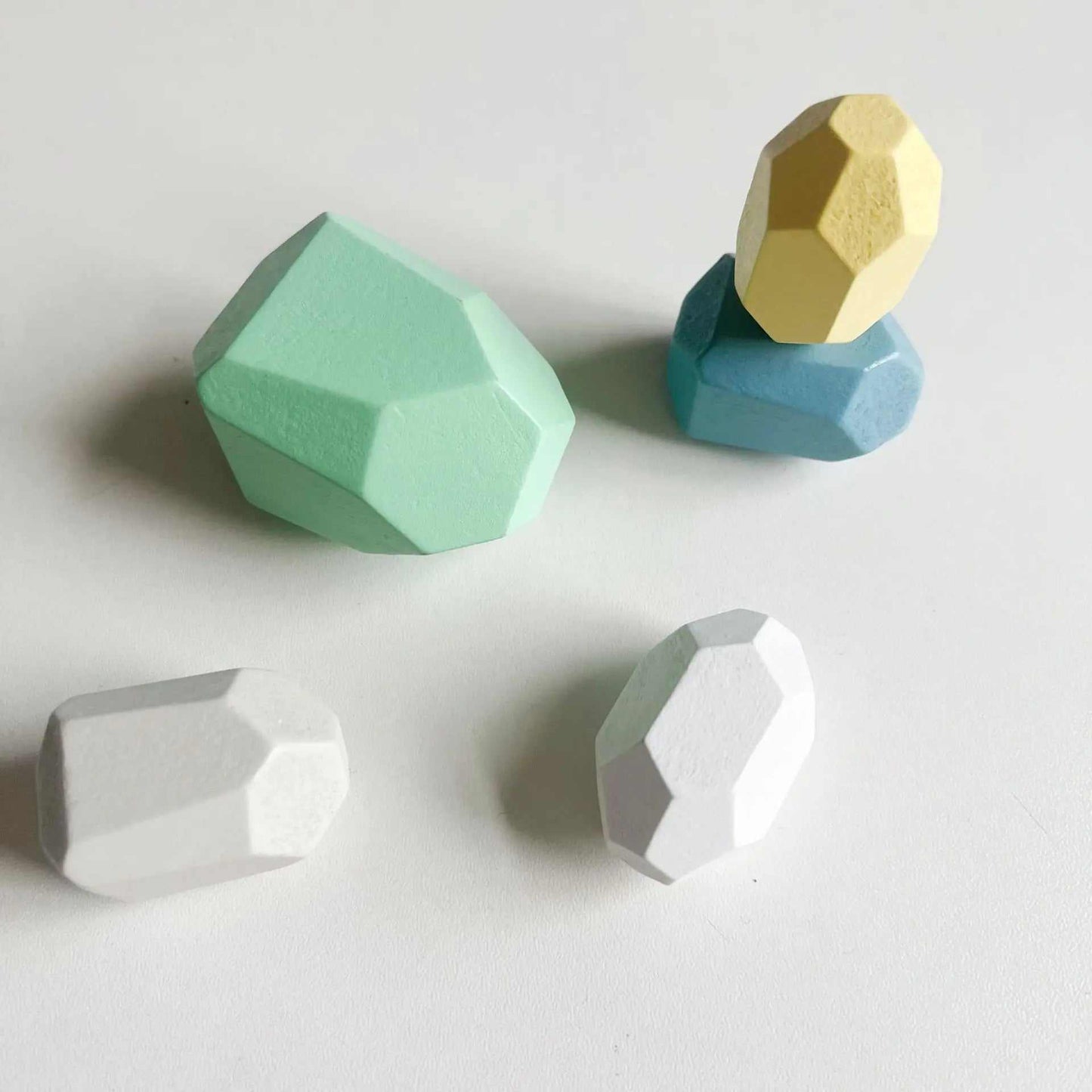 Kids wooden sensory stacking stones for toddler play, featuring smooth, colorful shapes to enhance balance and creativity.