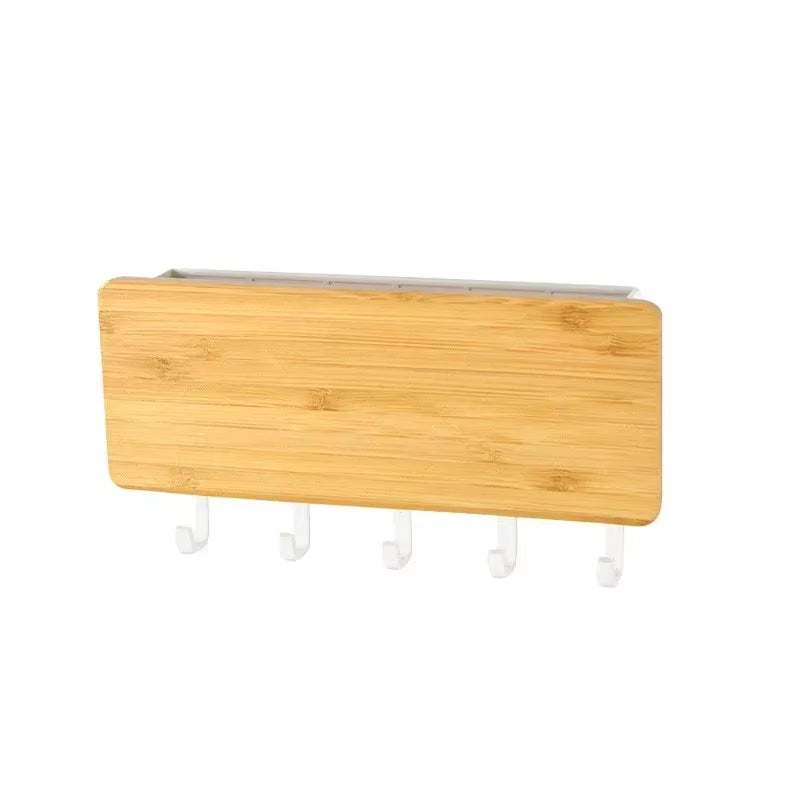 Wall-mounted bamboo key and coat hanger with five white hooks for home organization and space-saving storage.