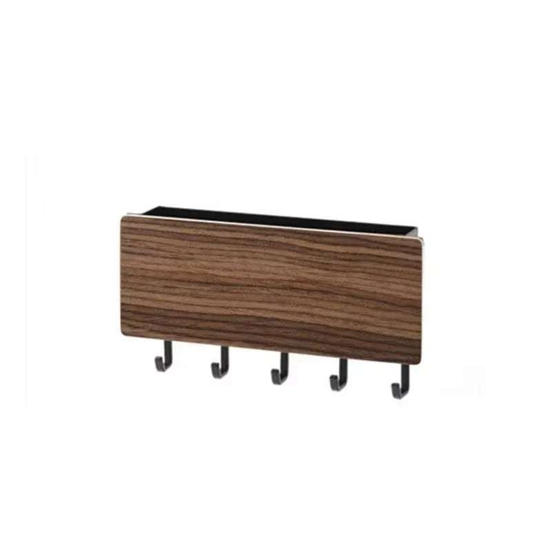 Wall-mounted bamboo key and coat hanger with five hooks and small shelf for home organization.