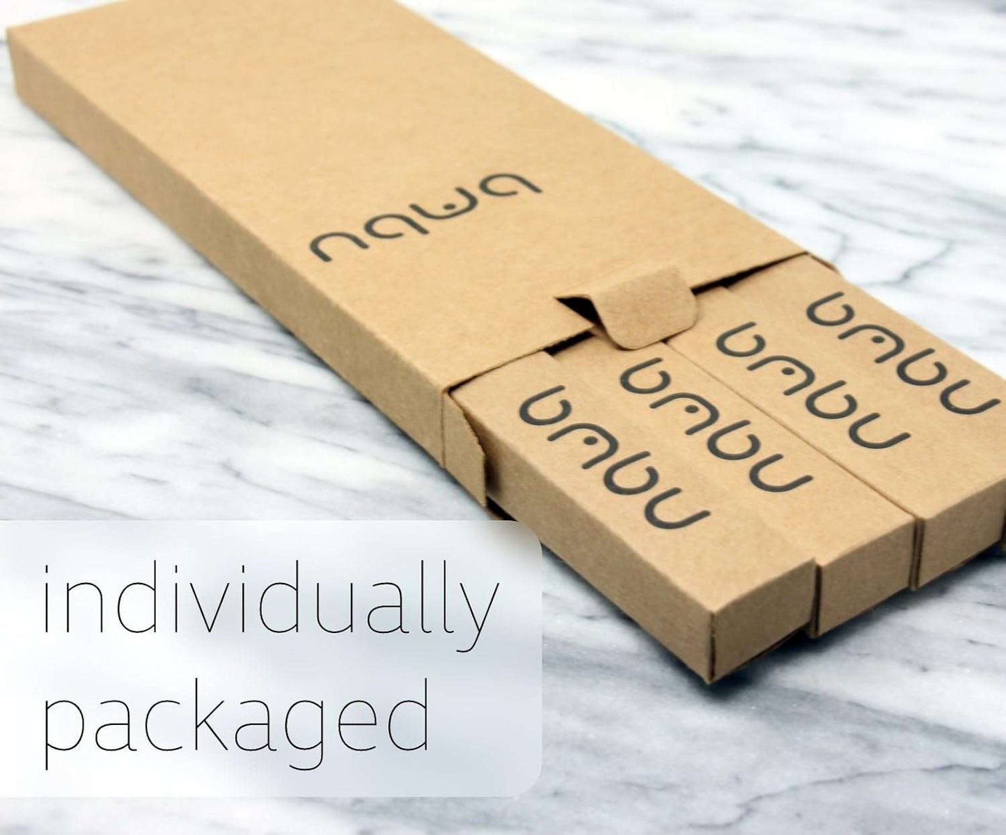 Eco-friendly wooden toothbrush set in biodegradable packaging.