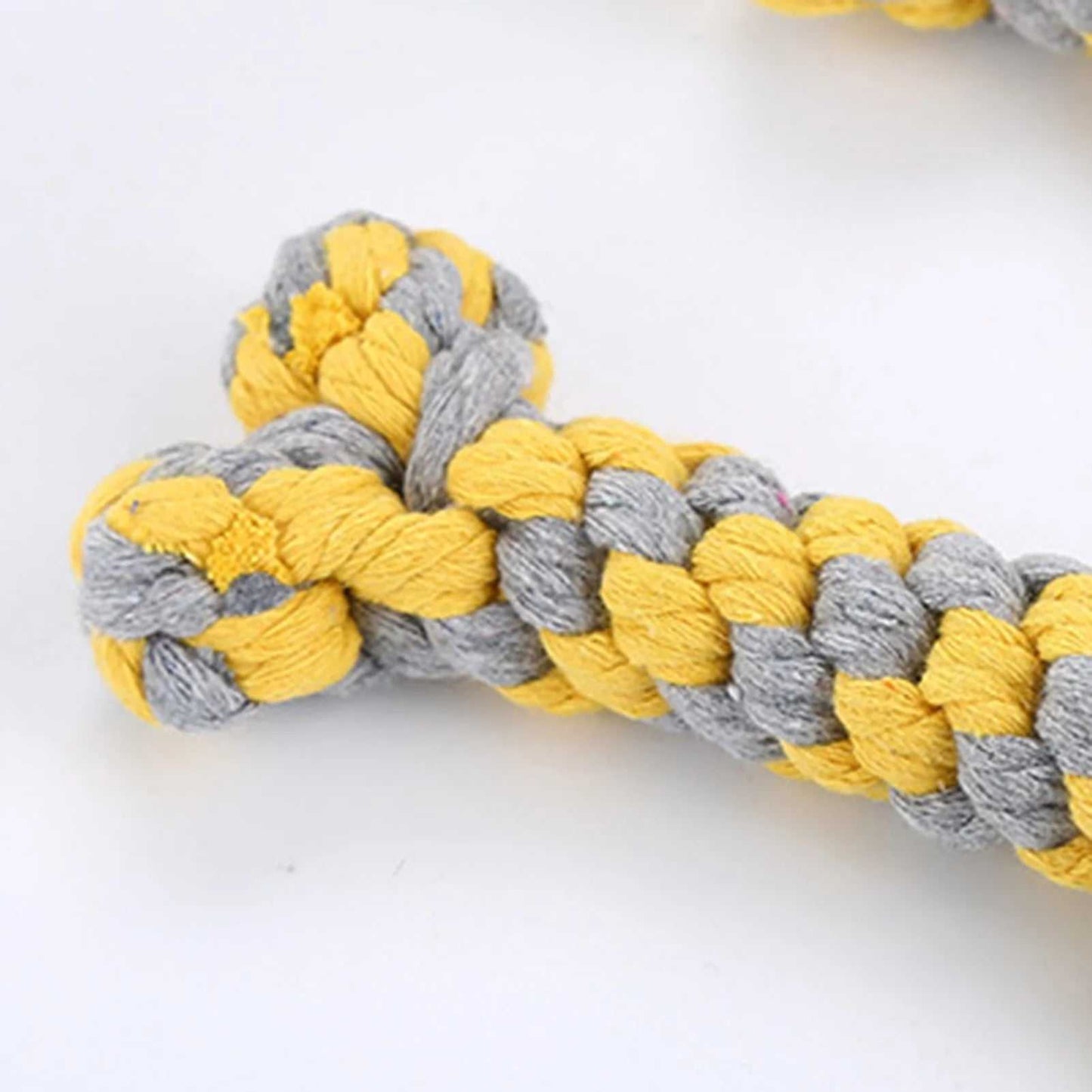 Durable dog rope chewing toy in yellow and gray for aggressive chewers, made from non-toxic cotton for dental health and interactive play.