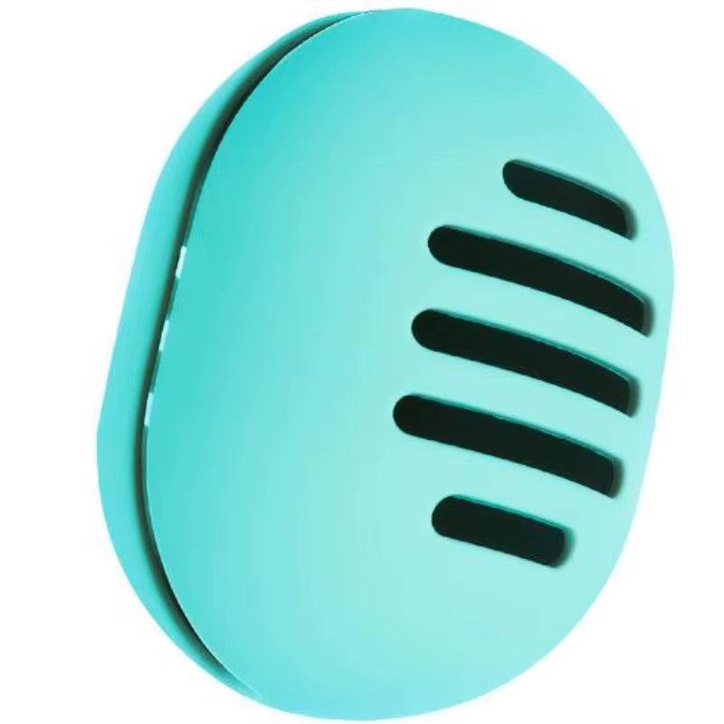 Eco-friendly turquoise silicone makeup sponge holder with ventilation slits.