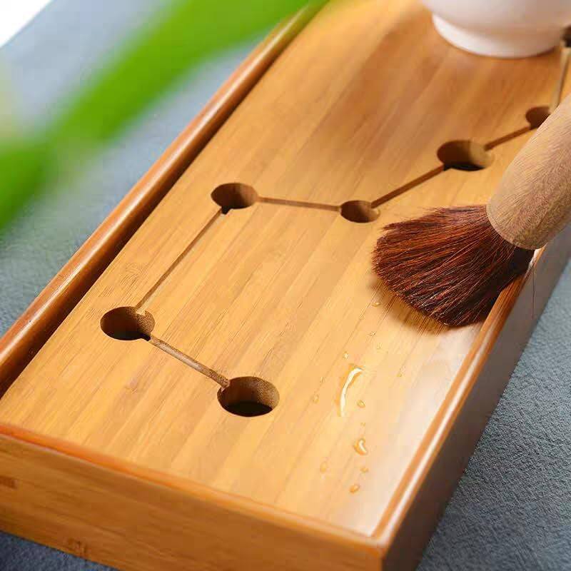 Bamboo tea tray with water drainage system, perfect for Gongfu tea ceremonies.