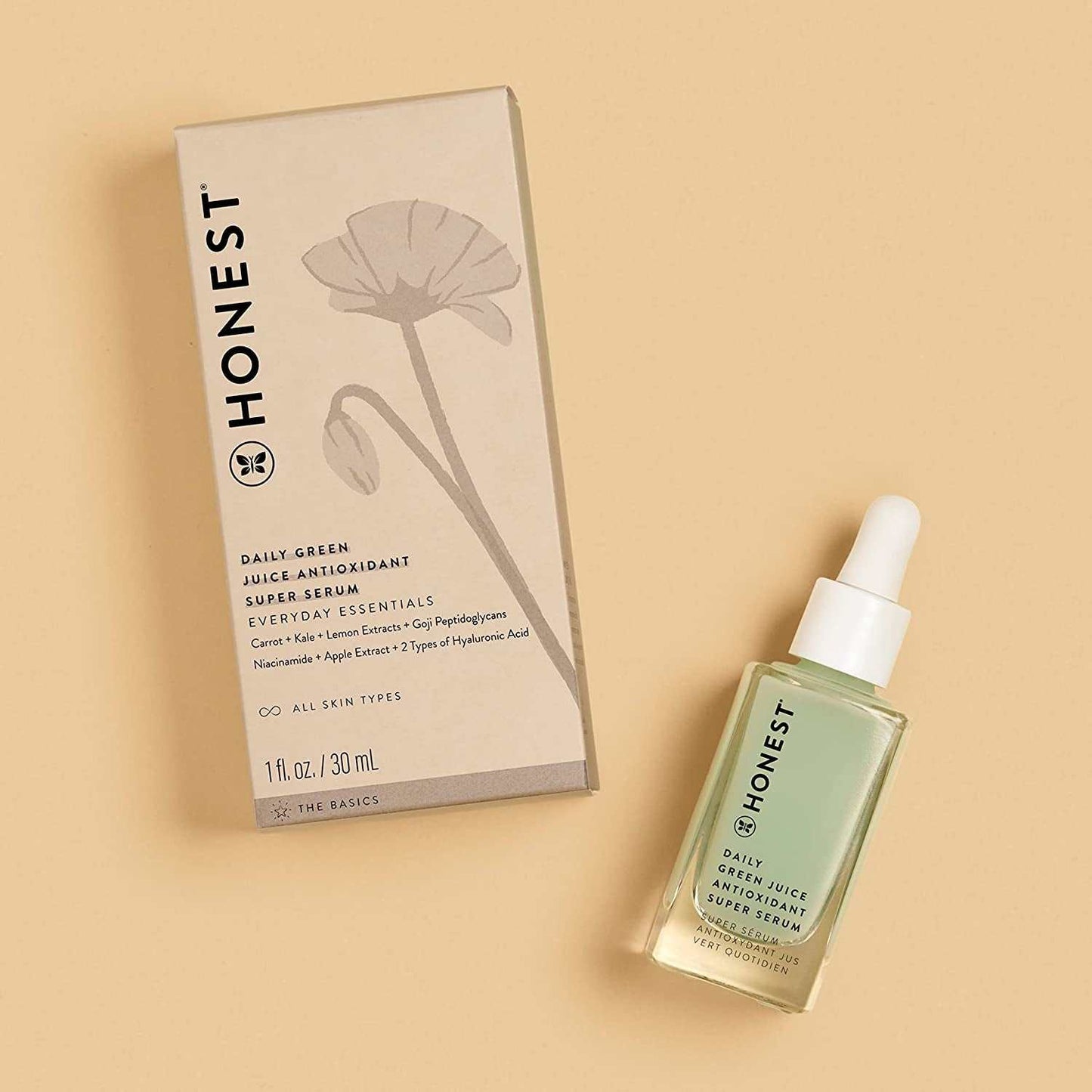 Light green glass bottle of Cruelty-Free Antioxidant Super Serum with packaging, ideal for hydrating and brightening skin care.