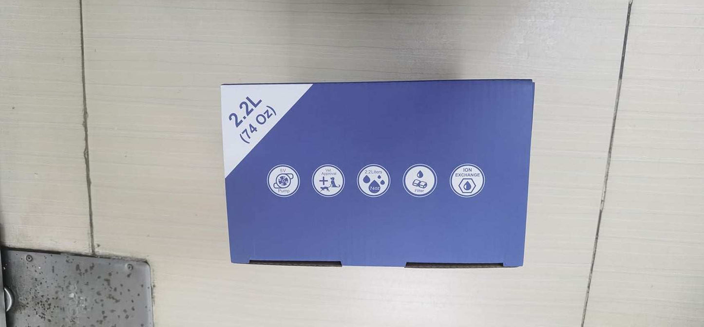 Blue box packaging of Pet Stainless Steel Water Fountain with capacity and feature icons visible
