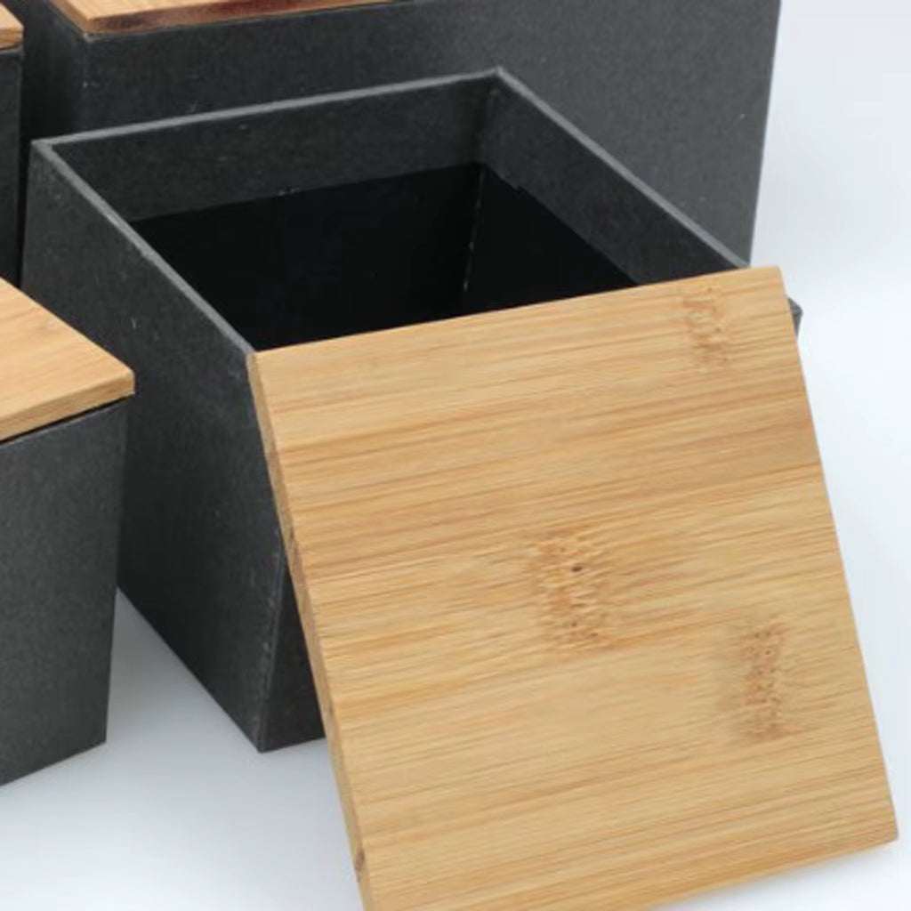 Kitchen metal storage box with bamboo lid for airtight food storage and kitchen organization.