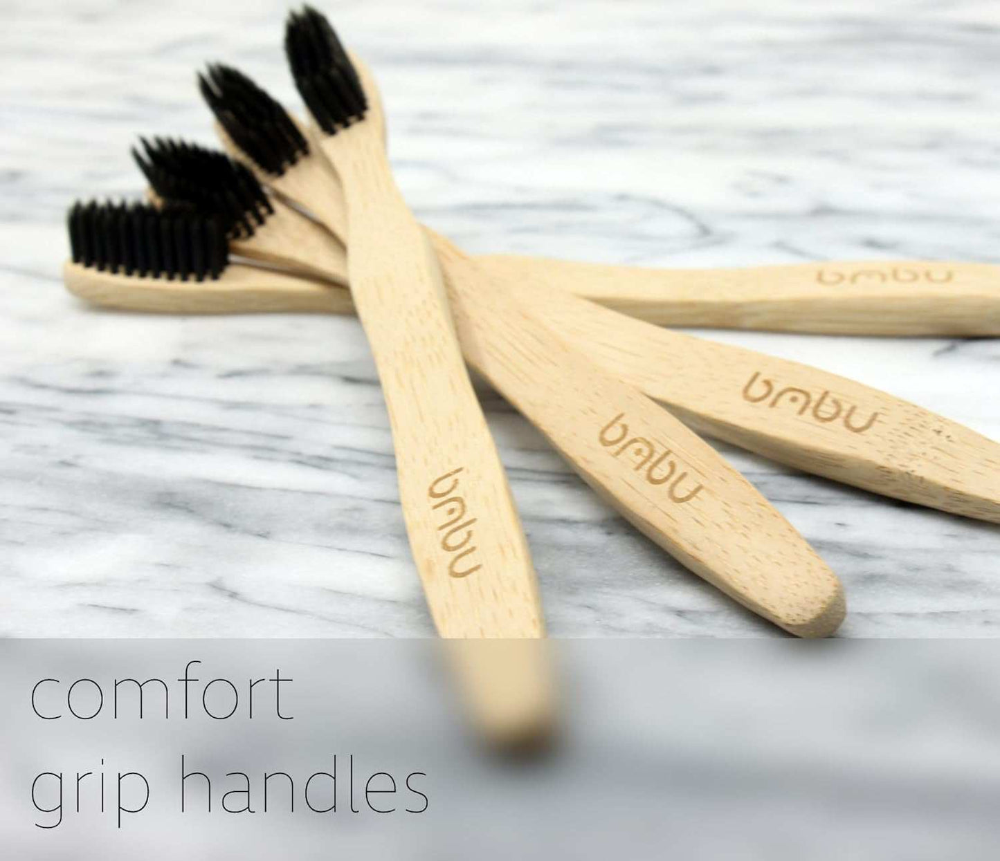 Eco-friendly wooden toothbrushes with charcoal bristles and ergonomic bamboo handles.