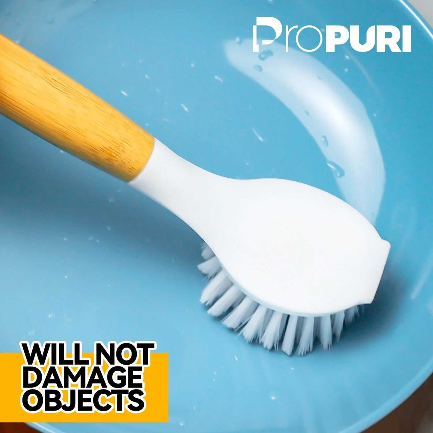 Bamboo handle dish brush on a blue plate, highlighting durable bristles and eco-friendly design.
