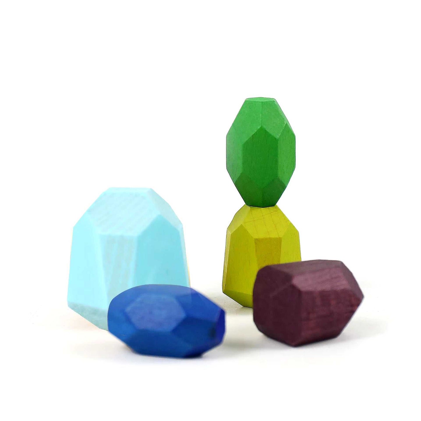 Colorful wooden stacking stones for sensory play, promoting balance and creativity in toddlers.