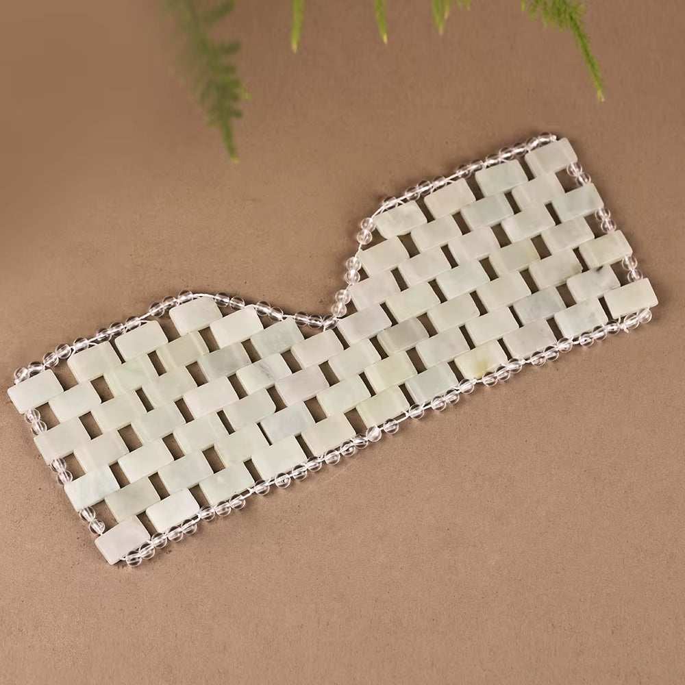 Natural jade face massager set with a cooling eye mask, jade roller, and gua sha tool for facial massage and skincare benefits.