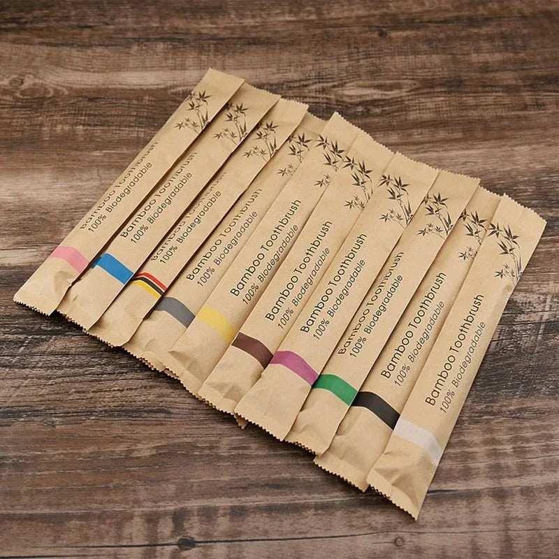 Set of 10 natural bamboo toothbrushes with colorful handles and biodegradable packaging for eco-friendly oral care