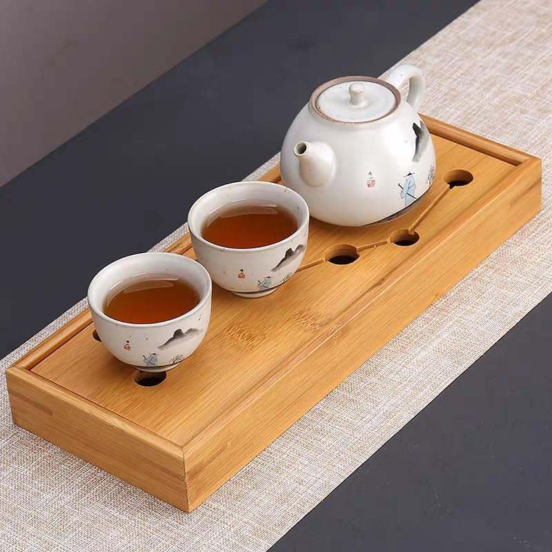 Bamboo Tea Tray for Gongfu tea ceremony with teapot and cups, featuring built-in water drainage.