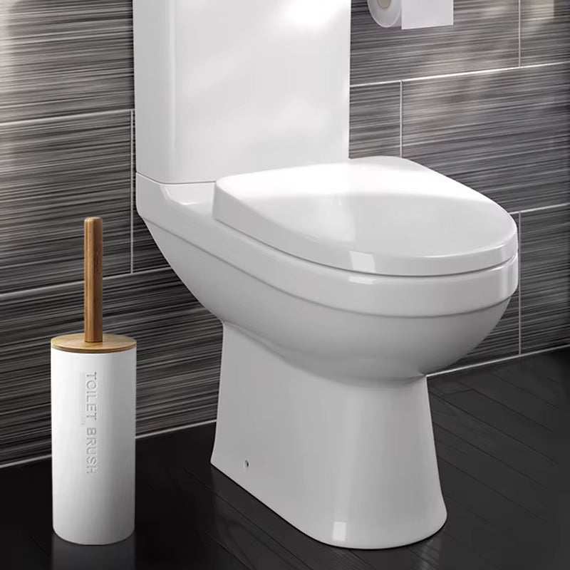 Minimalist bamboo toilet brush holder next to modern white toilet on dark tile floor for bathroom decoration