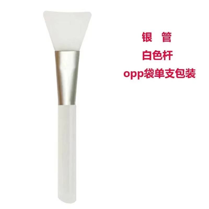 Silicone facial mask brush with a soft, flexible head and durable handle, ideal for applying skincare products efficiently.