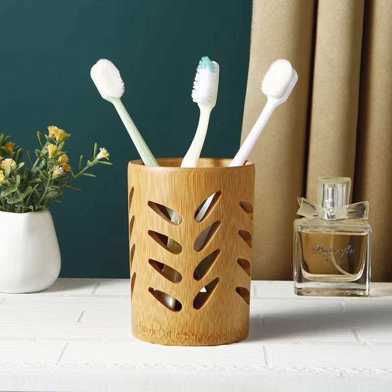 Bamboo toothbrush organizer with carved leaf design for bathroom countertop storage and organization