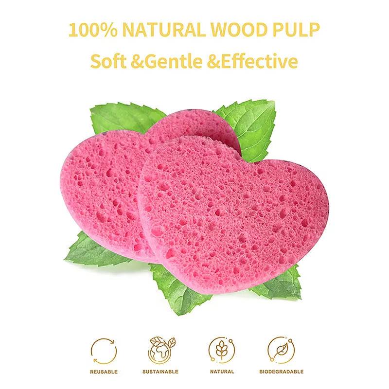Heart-shaped pink cellulose sponges for makeup removal, made from natural wood pulp, soft and eco-friendly.