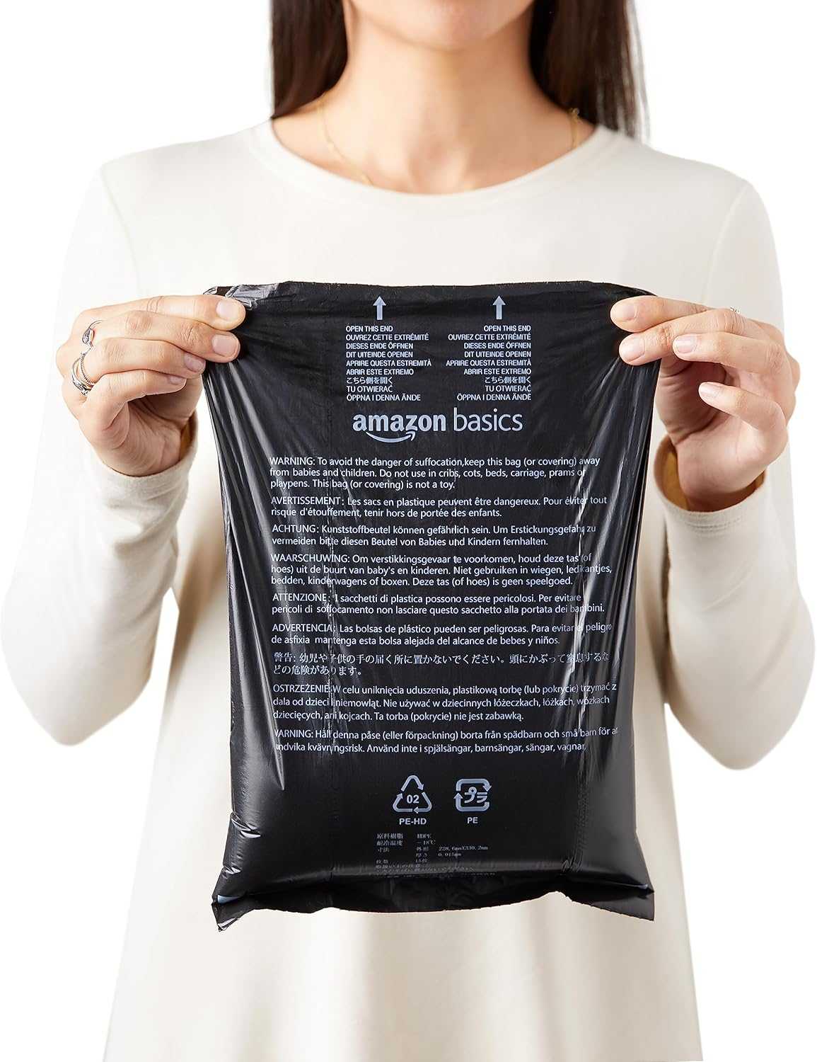 Black dog leak-proof poop bag held by person for easy waste disposal during dog walks