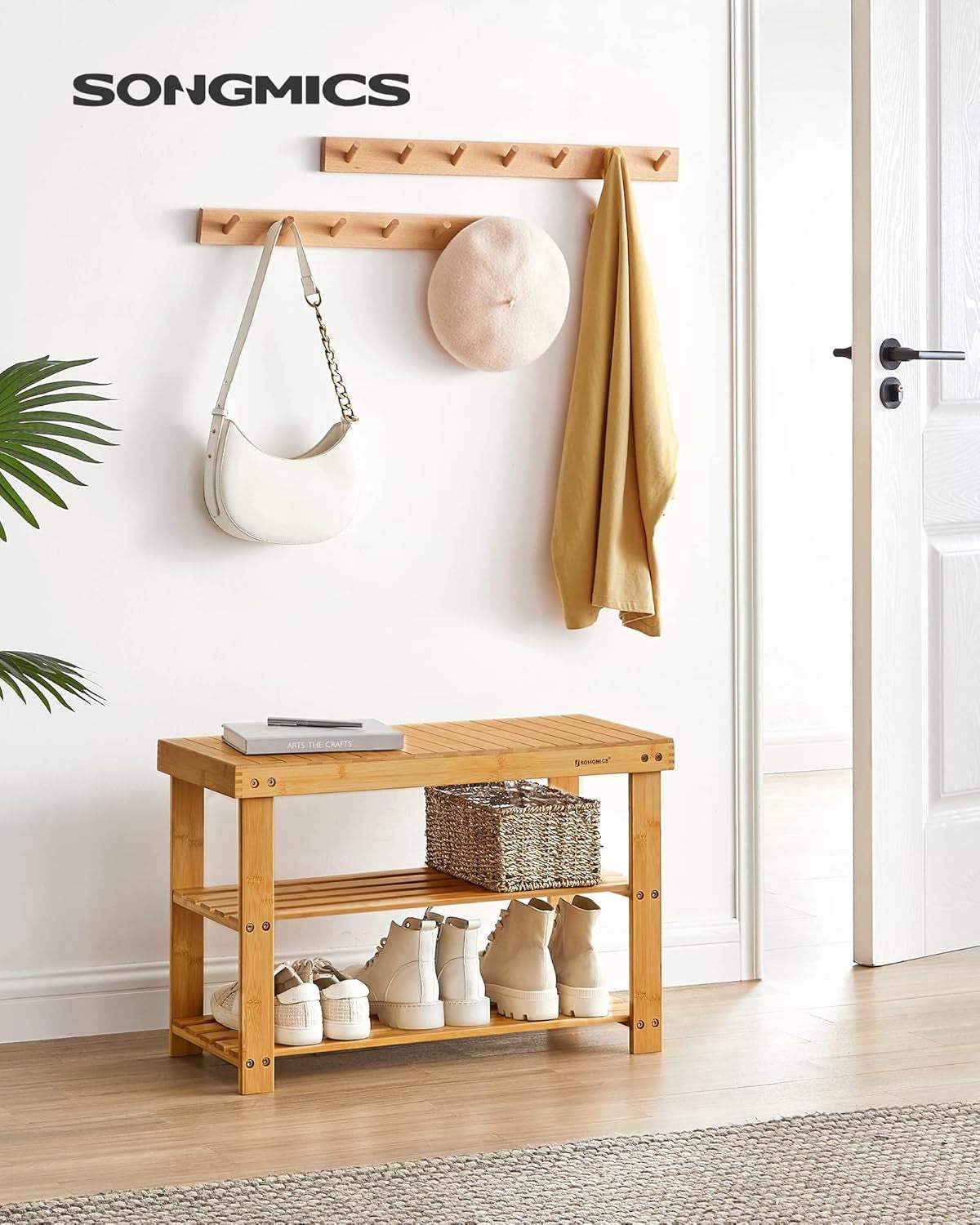 2-Tier bamboo shoe bench in entryway with storage shelves for shoes and seating, natural finish.