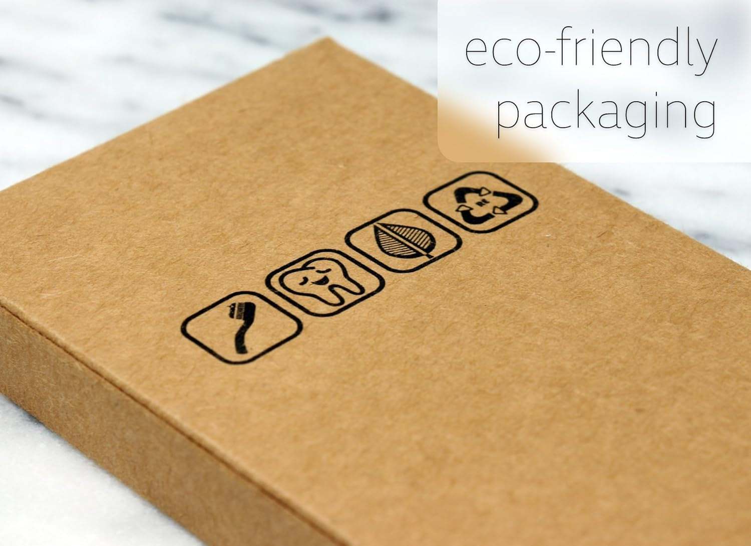 Eco-friendly packaging of wooden toothbrush with recycled symbols.