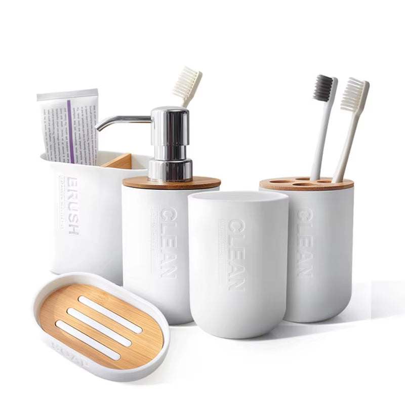 Minimalist white and bamboo bathroom decoration set with toothbrush holders, soap dispenser, toothpaste holder, and soap dish