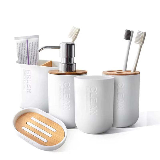 Minimalist white and bamboo bathroom decoration set with toothbrush holders, soap dispenser, toothpaste holder, and soap dish