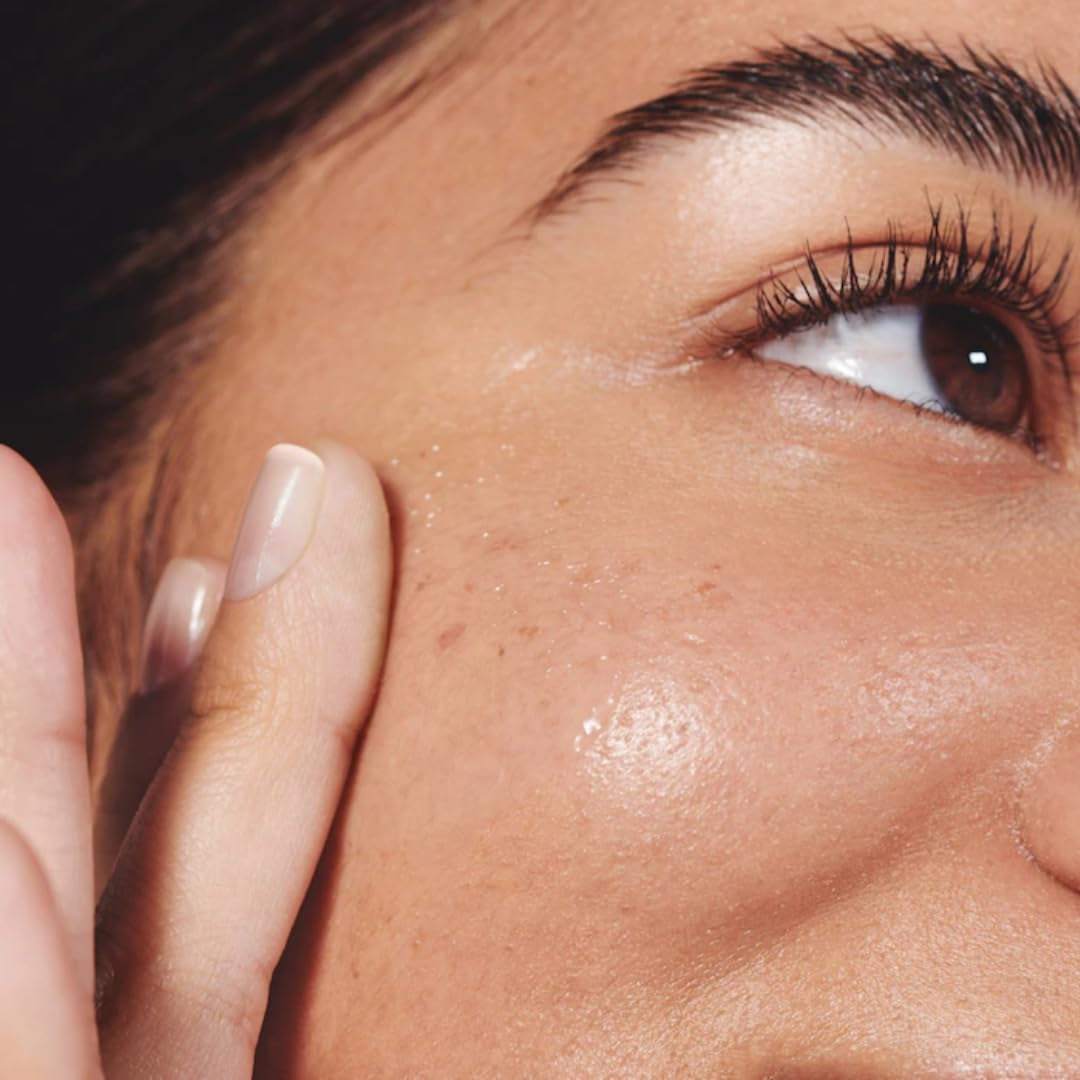 Close-up of a woman applying Cloud Jelly Plumping Hydration Face Serum for deep hydration and skin plumping