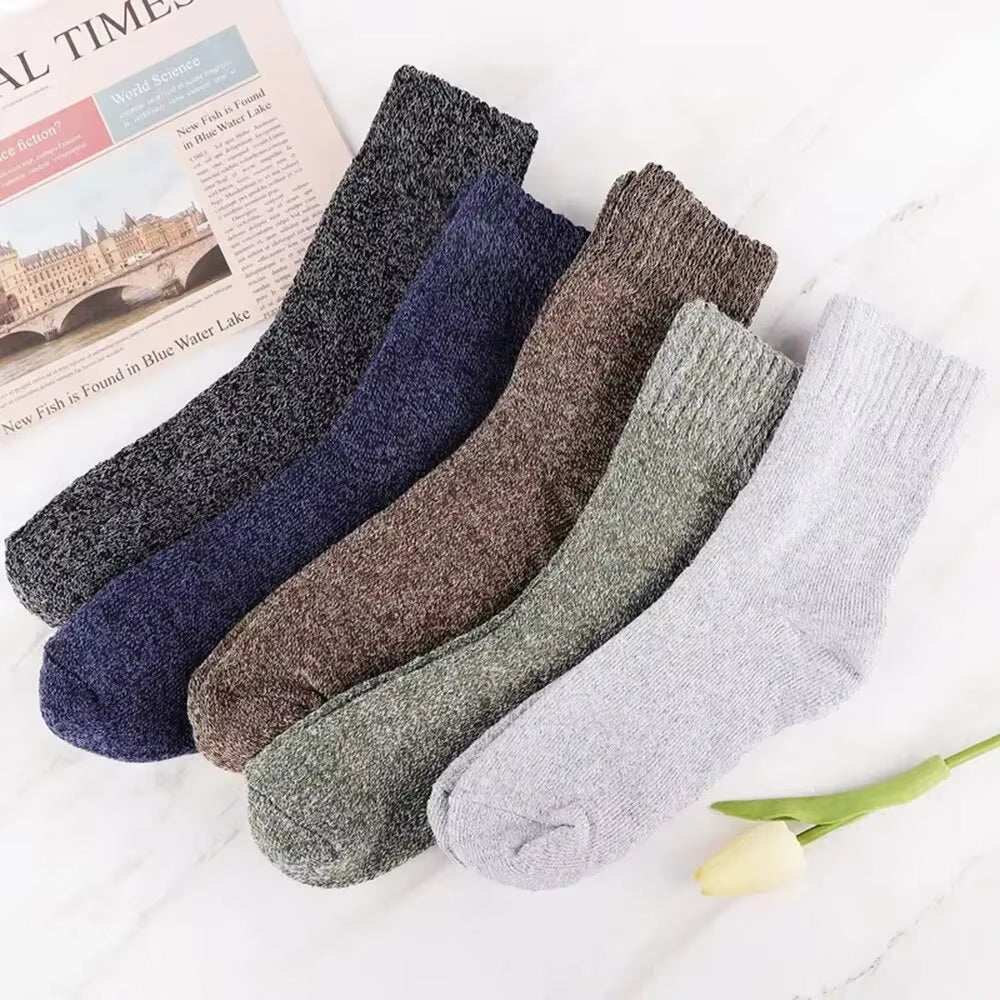 Warm solid color wool Warm Socks with towel-like texture, shown in various colors, ideal for cold weather comfort and insulation.