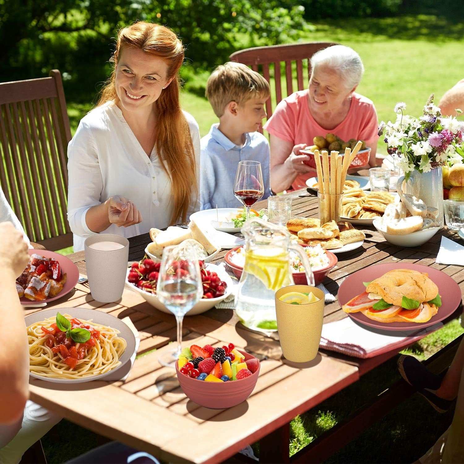 Eco-friendly unbreakable dinnerware set displayed at an outdoor family meal.