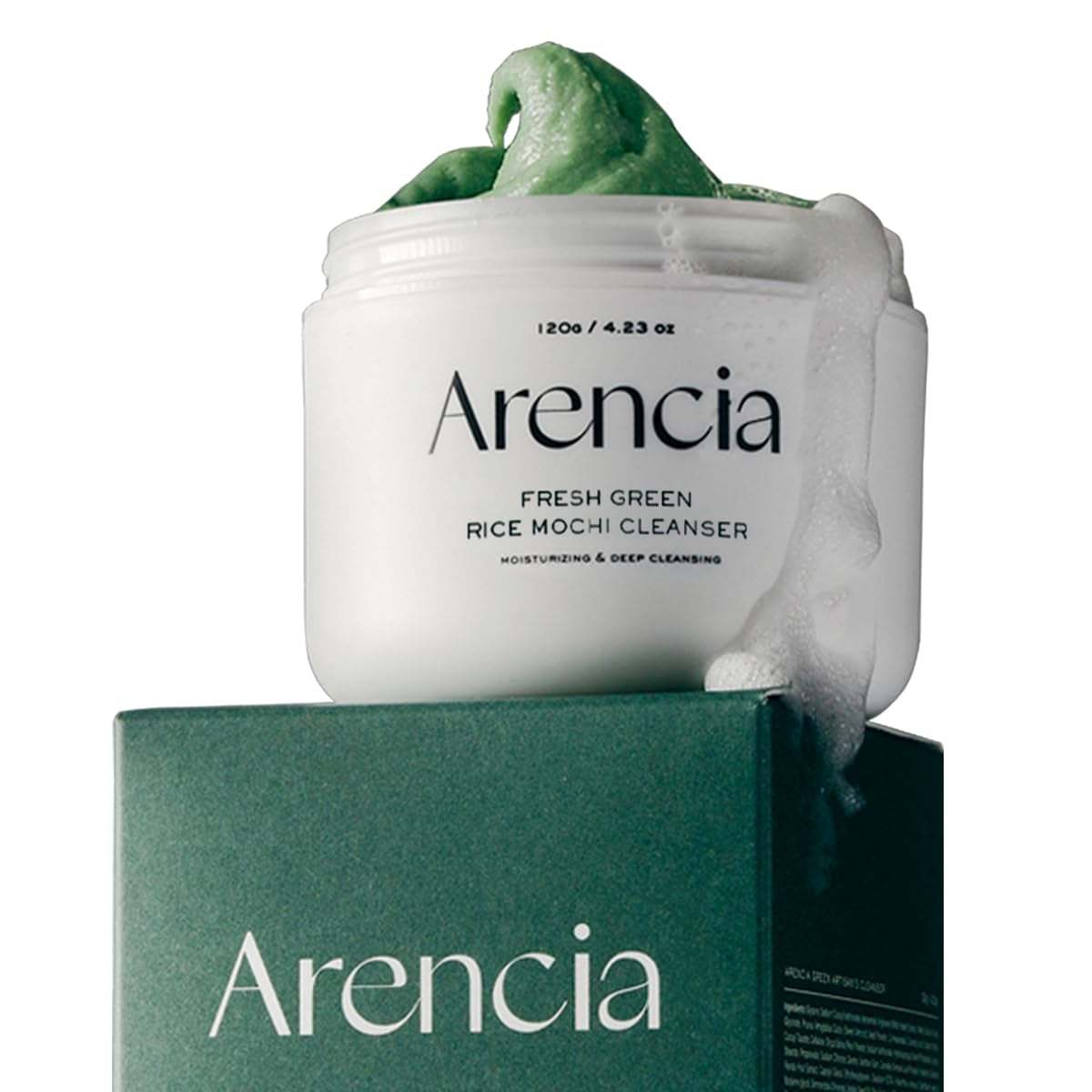 Arencia Fresh Green Rice Mochi Cleanser jar with green foaming face cleanser overflowing on dark green box for moisturizing deep cleansing