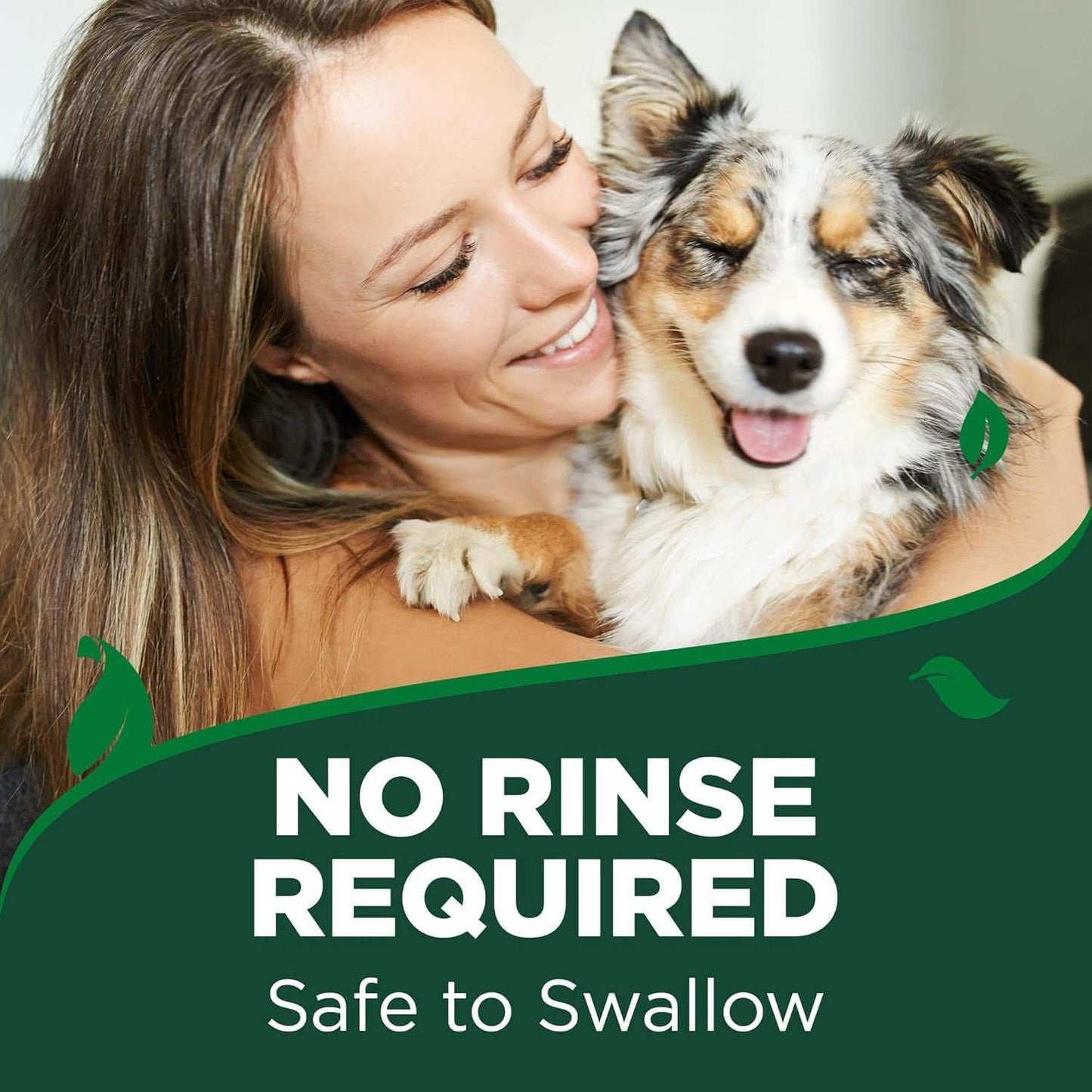 Woman smiling and holding happy dog illustrating pet toothpaste and toothbrushes safe to swallow with no rinse required