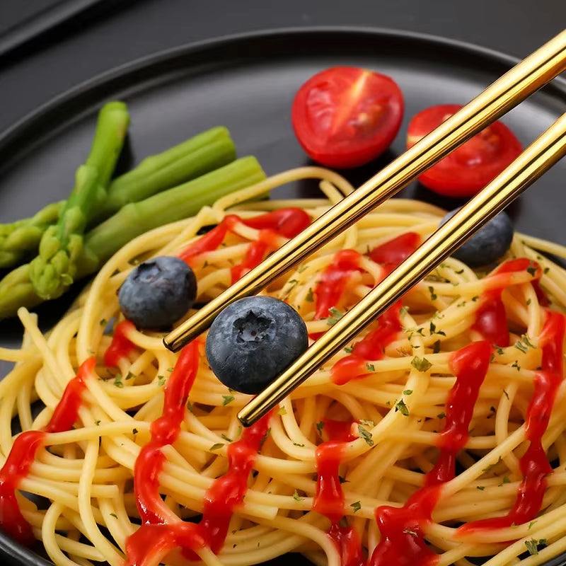 Eco-friendly reusable stainless steel cutlery set with chopsticks, spoon, fork, ideal for travel and everyday use.