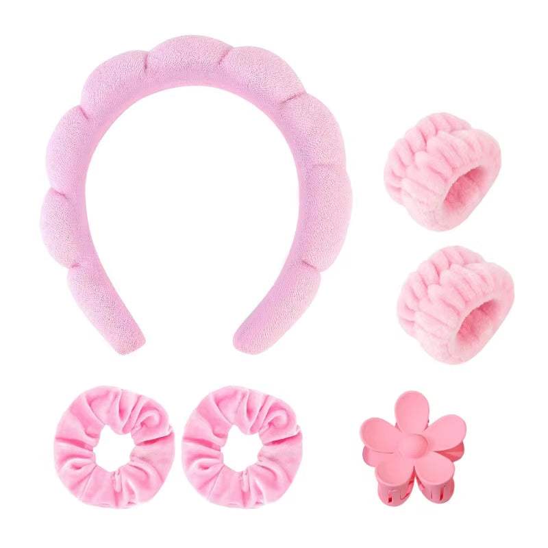 6-piece spa headband and wristband set in pink for skincare routines and beauty applications.