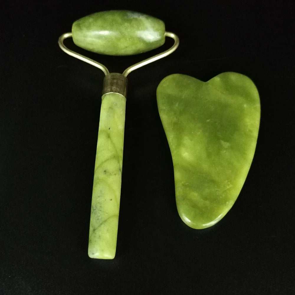Natural jade face roller and Gua Sha set for skincare, puffy reduction, and facial contour improvement.