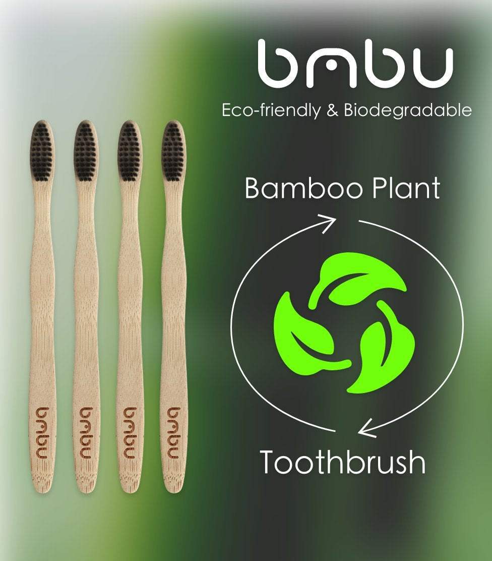 Wooden toothbrushes with bamboo handles and charcoal bristles, eco-friendly and biodegradable.