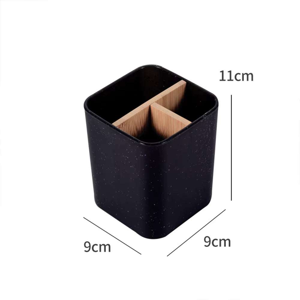 Black bamboo toothbrush and razor holder with divided compartments, compact and eco-friendly bathroom organizer